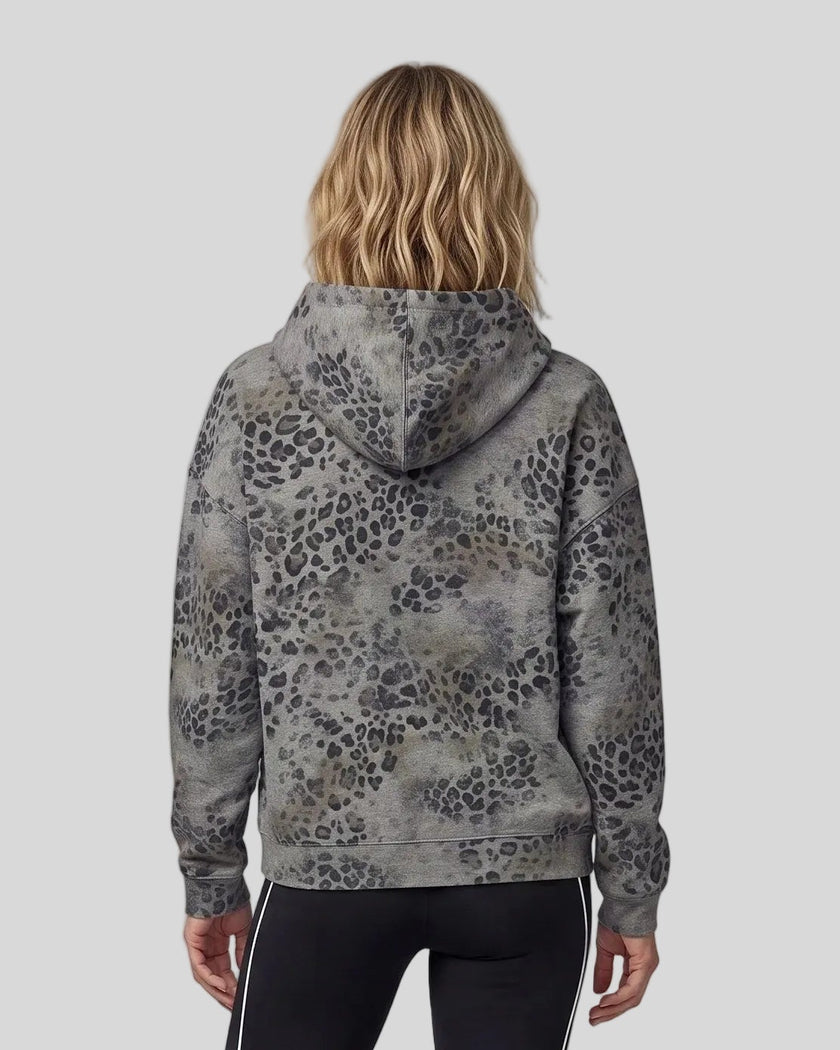 Upper body back view of woman wearing Leopard Vintage Accent Hoodie with oversized hood in Leopard Dark Gray