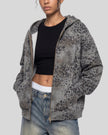 Upper body front angle view of woman wearing Leopard Vintage Accent Hoodie open in Leopard Dark Gray