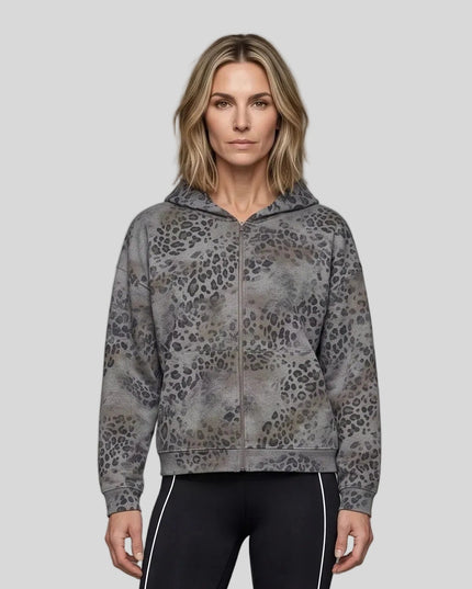 Upper body front view of woman wearing Leopard Vintage Accent Hoodie zipped closed in Leopard Dark Gray