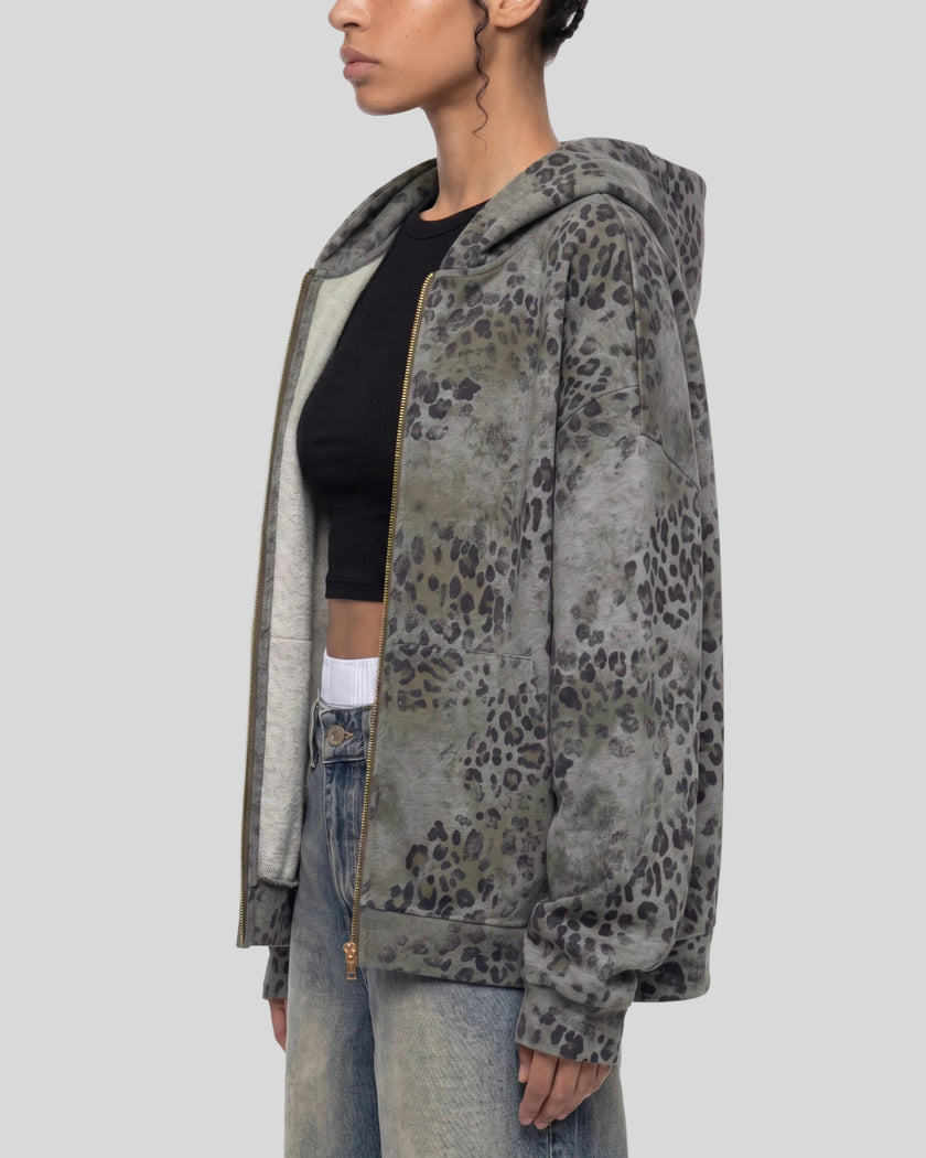 Upper body side view of woman wearing oversized Leopard Vintage Accent Hoodie in Leopard Dark Gray