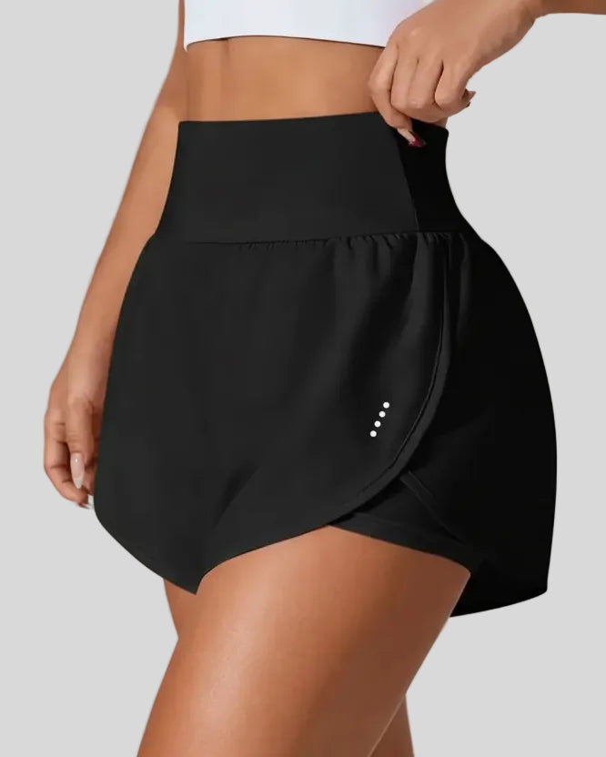Front left angle of Athlesi LiftMove Pocket Active Shorts in black showing flowy silhouette