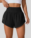 Front view of Athlesi LiftMove Pocket Active Shorts in black with high-rise waistband and relaxed outer layer