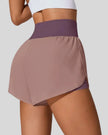 Back view of Athlesi LiftMove Pocket Active Shorts in dusty pink showing smooth waistband and coverage