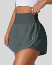 Front left angle of Athlesi LiftMove Pocket Active Shorts in gray showing flowy silhouette