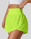 Front left angle of Athlesi LiftMove Pocket Active Shorts in neon green showing flowy silhouette