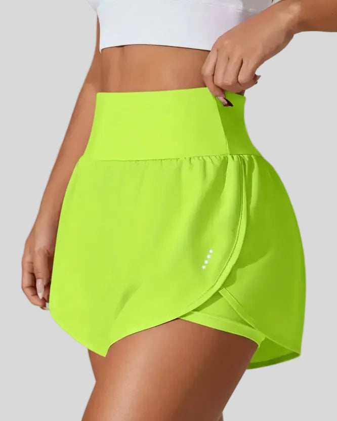 Front left angle of Athlesi LiftMove Pocket Active Shorts in neon green showing flowy silhouette