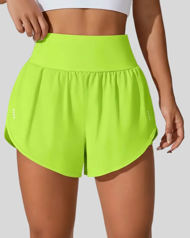 Front view of Athlesi LiftMove Pocket Active Shorts in neon green with high-rise waistband and relaxed outer layer