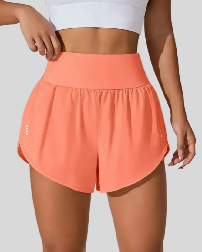 Front view of Athlesi LiftMove Pocket Active Shorts in orange with high-rise waistband and relaxed outer layer