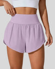 Front view of Athlesi LiftMove Pocket Active Shorts in pink purple with high-rise waistband and relaxed outer layer