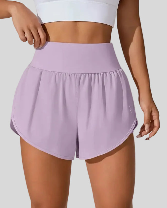 Front view of Athlesi LiftMove Pocket Active Shorts in pink purple with high-rise waistband and relaxed outer layer