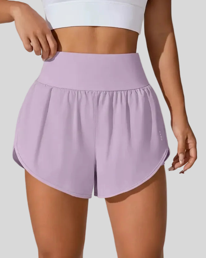 Front view of Athlesi LiftMove Pocket Active Shorts in pink purple with high-rise waistband and relaxed outer layer