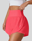 Front left angle of Athlesi LiftMove Pocket Active Shorts in strawberry showing flowy silhouette