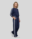 Front angle view of model wearing Athlesi LineFlow Crewneck Lounge Set in Navy