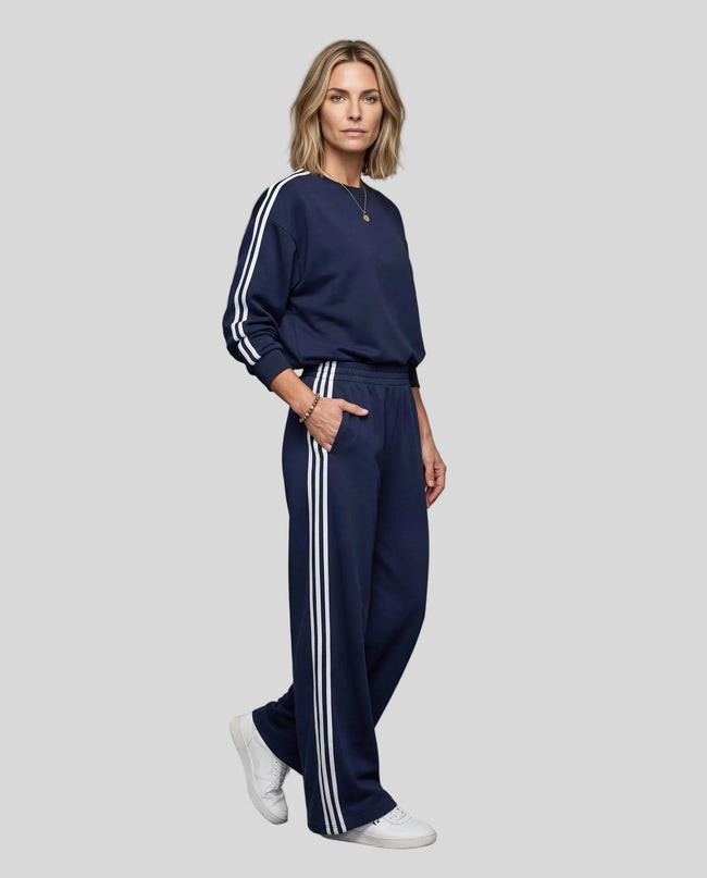 Front angle view of model wearing Athlesi LineFlow Crewneck Lounge Set in Navy