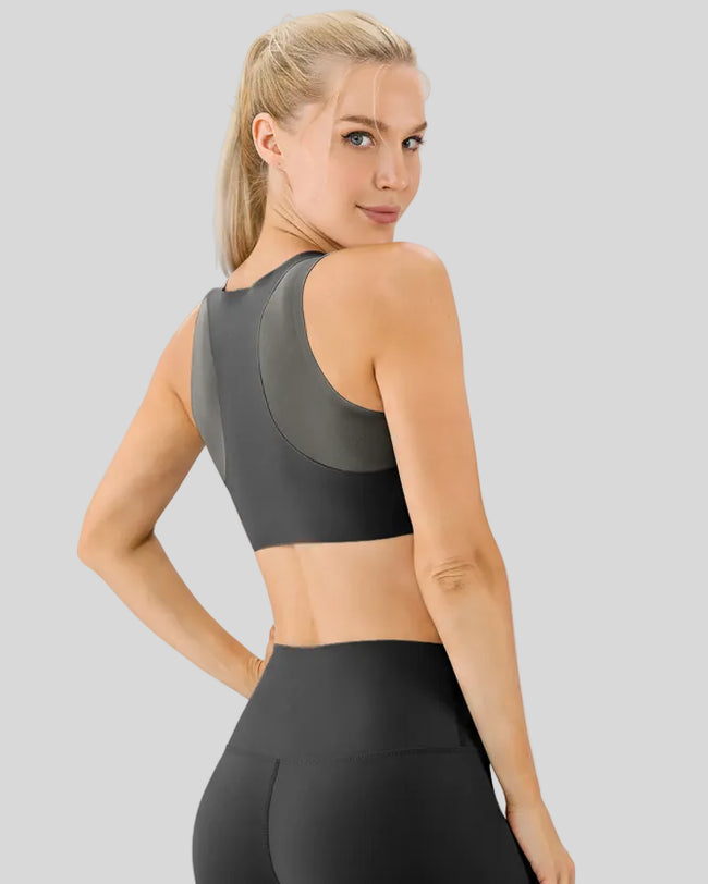 Back view of Athlesi LineForm Sports Bra in black showcasing extended support panel design