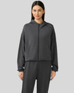 Dark gray zip-up hoodie with relaxed fit and dropped shoulders, front view.