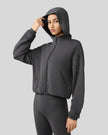 Side view highlighting relaxed silhouette and soft fabric drape in dark gray