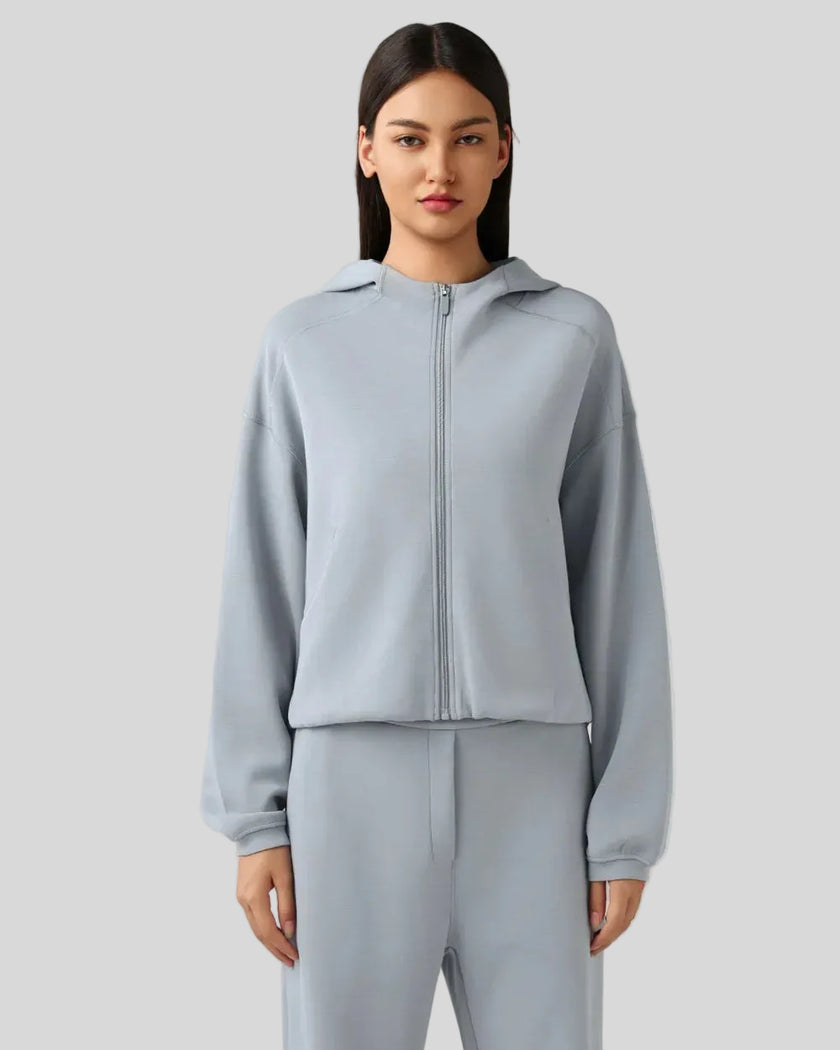 Light blue zip-up hoodie with relaxed fit and dropped shoulders, front view
