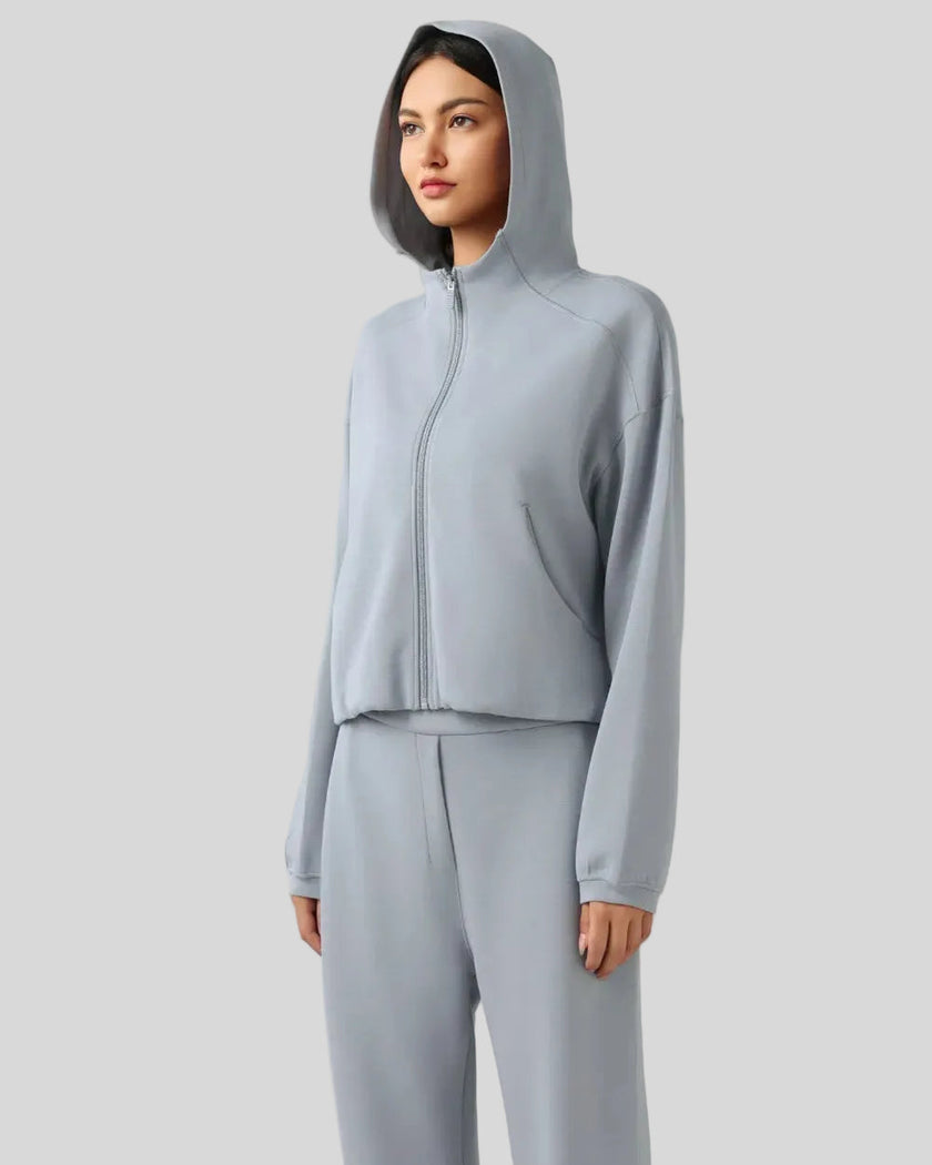 Side view highlighting relaxed silhouette and soft fabric drape in light blue