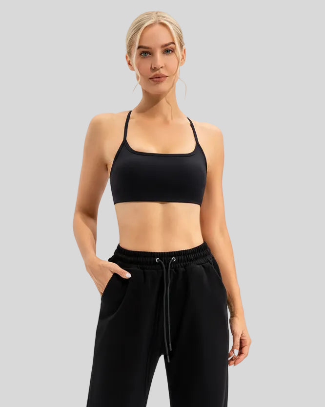 Elevated studio-to-street look with LumaForm Crisscross Sports Bra in Black - Athlesi