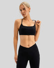 Seamless black sports bra featuring slim shoulder straps