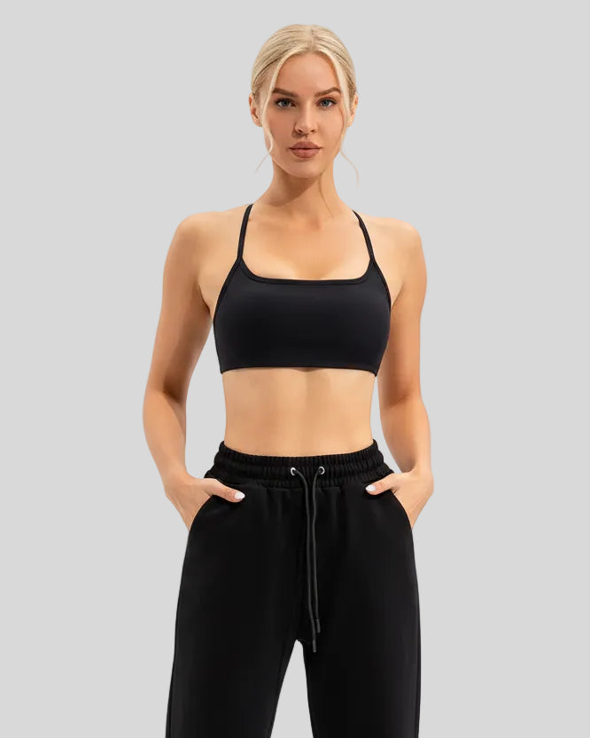Soft, stretchy performance fabric of LumaForm Crisscross Sports Bra in Black - Athlesi