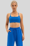Seamless blue sports bra featuring slim shoulder straps