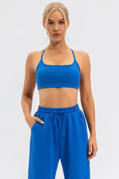 Seamless blue sports bra featuring slim shoulder straps