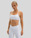 Feminine coverage with LumaForm Crisscross Sports Bra in White - Athlesi