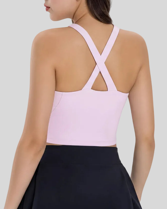 Back view of Athlesi LumaForm cross-neck active cami in blush pink