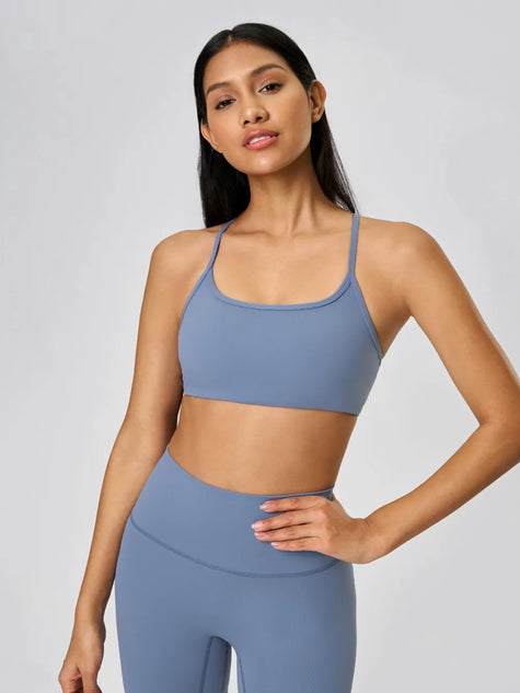 Scoop neckline with a smooth, feminine shape sports bra in dusty blue - Athlesi