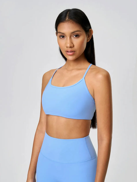 Scoop neckline with a smooth, feminine shape sports bra in light blue - Athlesi