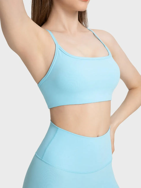 Close-up of the pastel blue sports bra, focusing on the breathable, moisture-wicking fabric texture - Athlesi