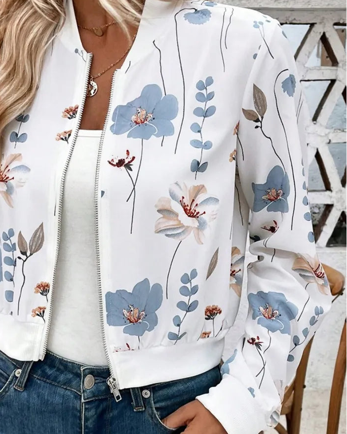 Closeup of floral print and zip-front detail on lightweight sporty jacket