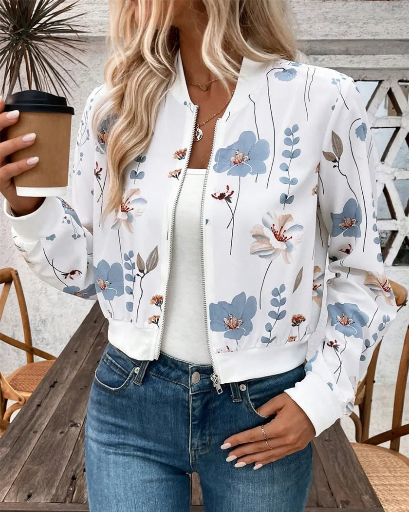 Lifestyle view of floral zip-up jacket styled with jeans for coffee runs travel and everyday movement