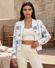Lifestyle view of floral zip-up jacket styled with leggings for coffee runs travel and everyday movement
