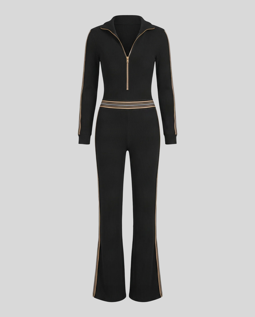 Front view of Monaco Hooded Jumpsuit in Black with zip neckline, contrast waist stripes and wide-leg silhouette