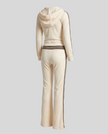 Back view of Monaco Hooded Jumpsuit in Milky White showing hood, striped waistband and wide-leg design