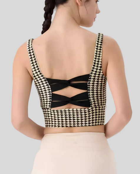Back view of Monochic sports bra with crossback straps and houndstooth pattern