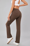 Back angled view of Athlesi MotionEase Pocket active pant in brown