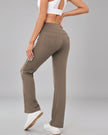 Back angled view of Athlesi MotionEase Pocket active pant in camel