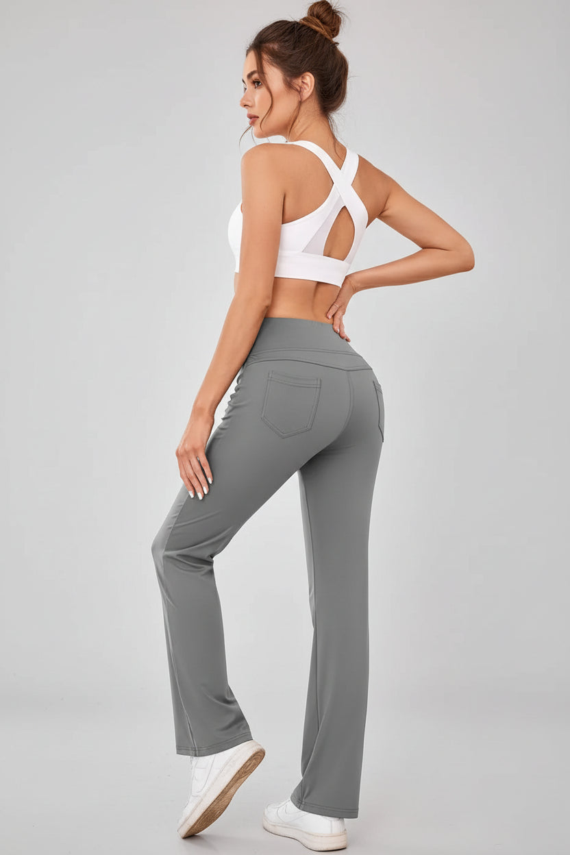Back angled view of Athlesi MotionEase Pocket active pant in gray
