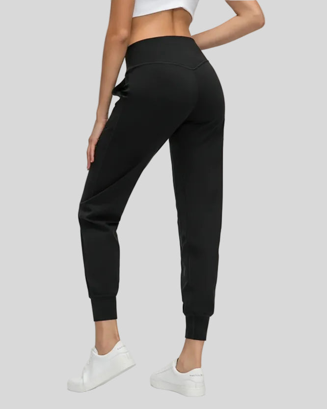 Back view of black Athlesi MotionEase Sculpt Jogger Pant with jogger fit