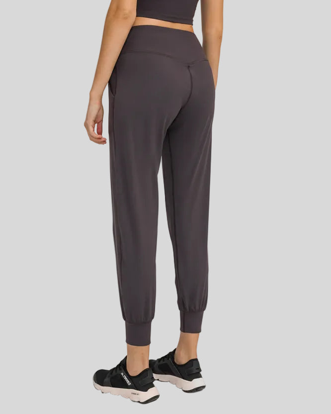 Back view of dark gray Athlesi MotionEase Sculpt Jogger Pant with jogger fit