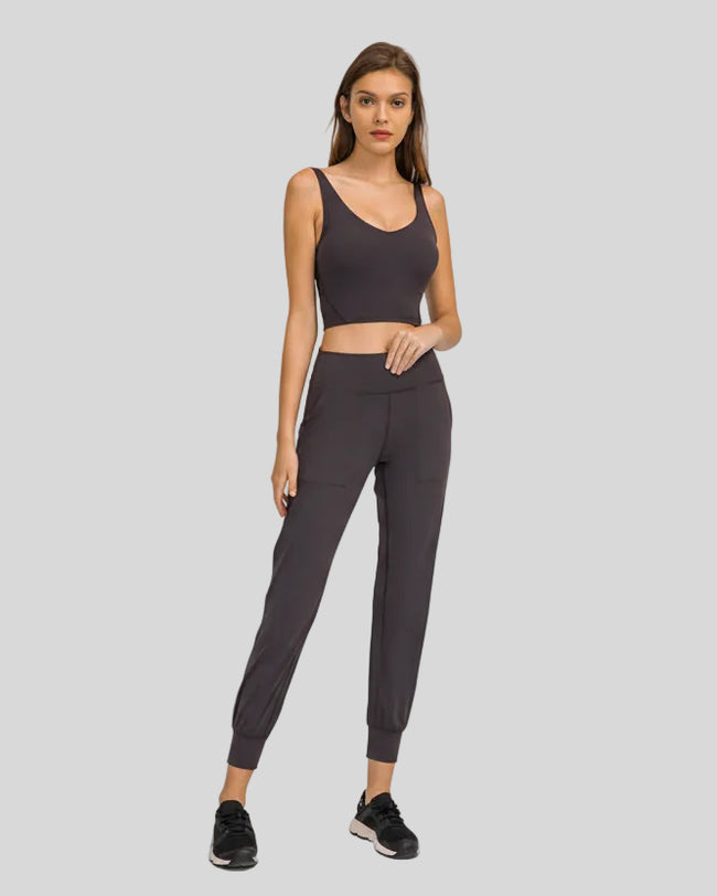 Front view of Athlesi MotionEase Sculpt Jogger Pant in dark gray with wide waistband