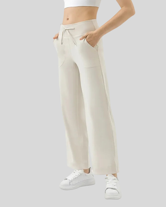 MotionEase Utility Active Pant cream front angle showing relaxed fit and pockets