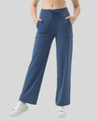 MotionEase Utility Active Pant dusty blue front angle showing relaxed fit and pockets