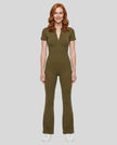 Model wearing the MotionFlow Flared Leg Jumpsuit in Army Green viewed from the front