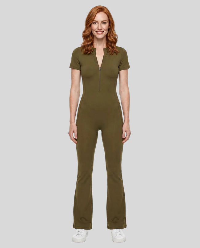 Model wearing the MotionFlow Flared Leg Jumpsuit in Army Green viewed from the front