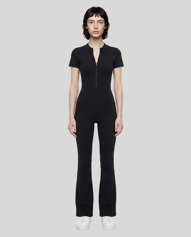 Model wearing the MotionFlow Flared Leg Jumpsuit in Black viewed from the front